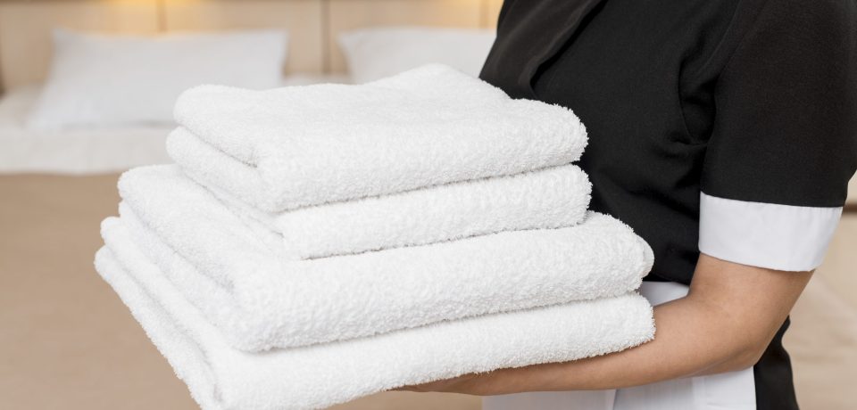 chambermaid-preparing-hotel-room