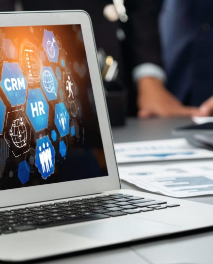 Analyst team utilizing BI Fintech to analyze financial report. Prodigy Panorama shot analyst team utilizing BI Fintech to analyze financial report with laptop. Businesspeople analyzing BI data dashboard displayed on laptop screen for business insight. Prodigy