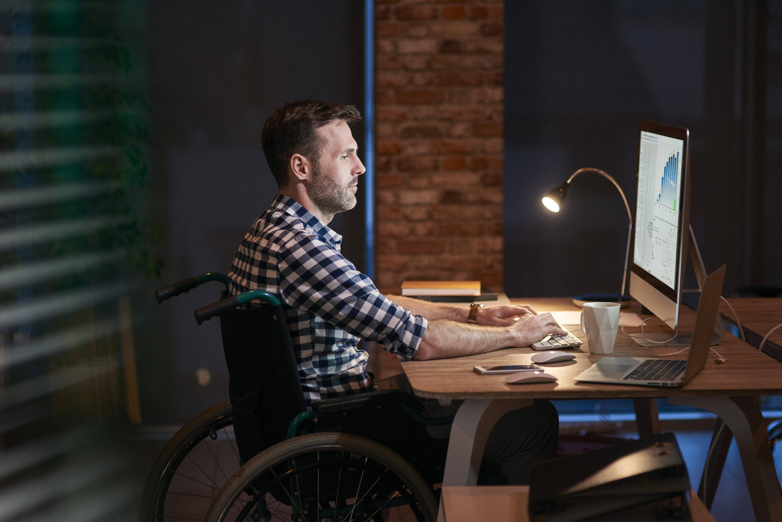 Side view of disabled businessman working in office Accessibility Testing